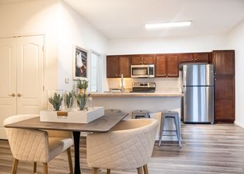 Kitchen and dining area in a 555 waverly unit